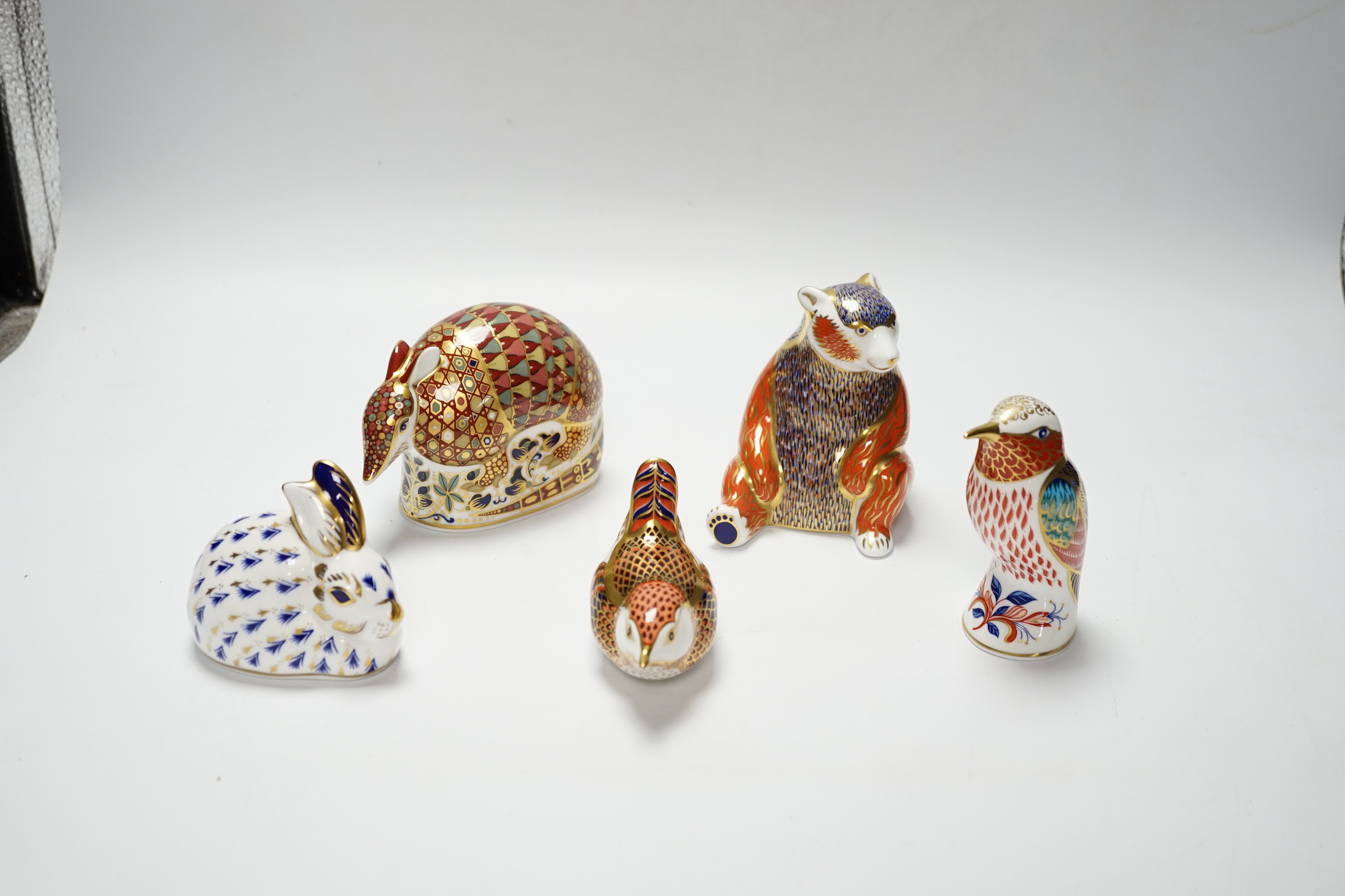 A collection of five Royal Crown Derby animal and bird paperweights